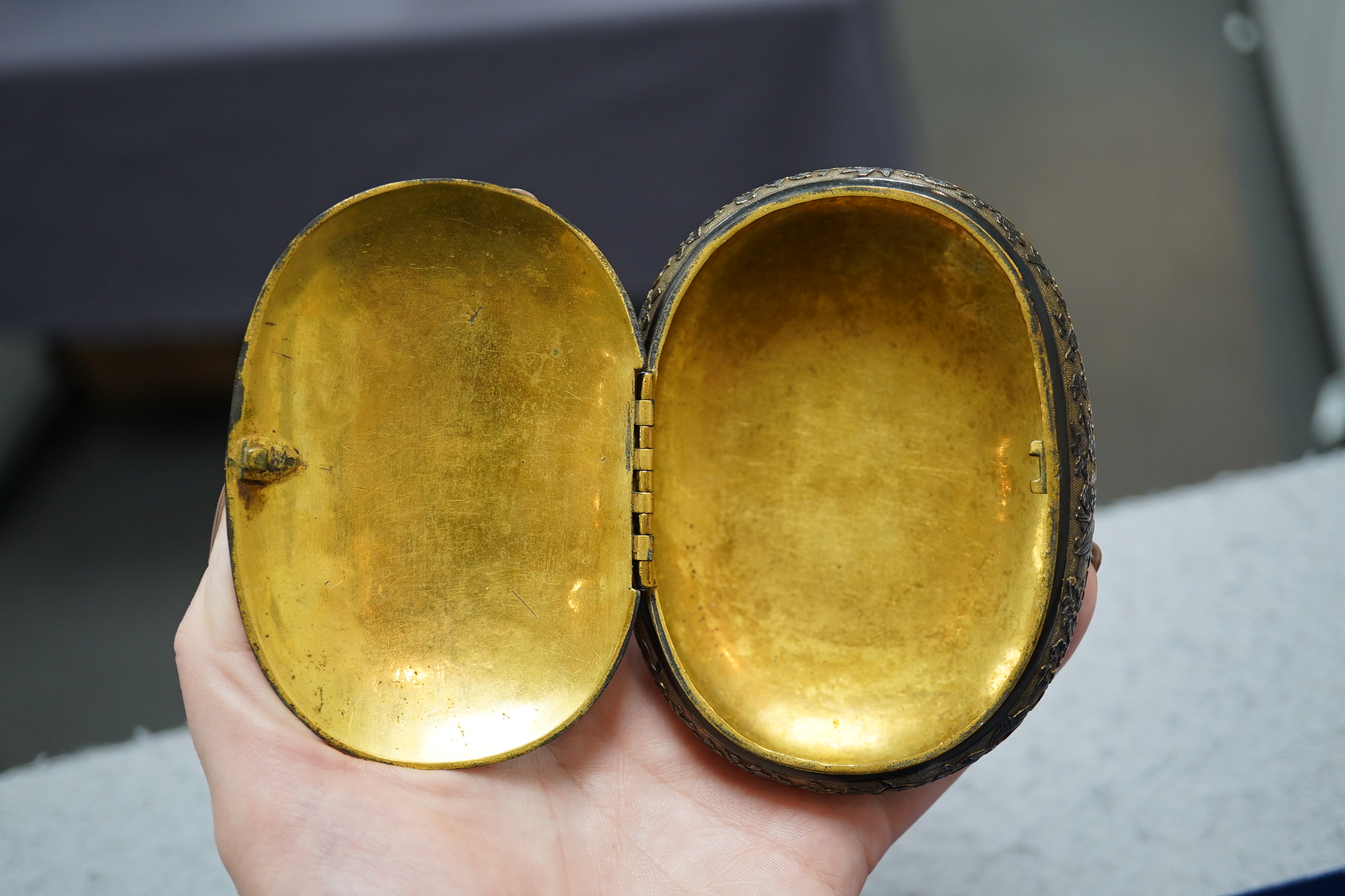 A Japanese export gilt bronze Sawasa oval tobacco box, 18th century